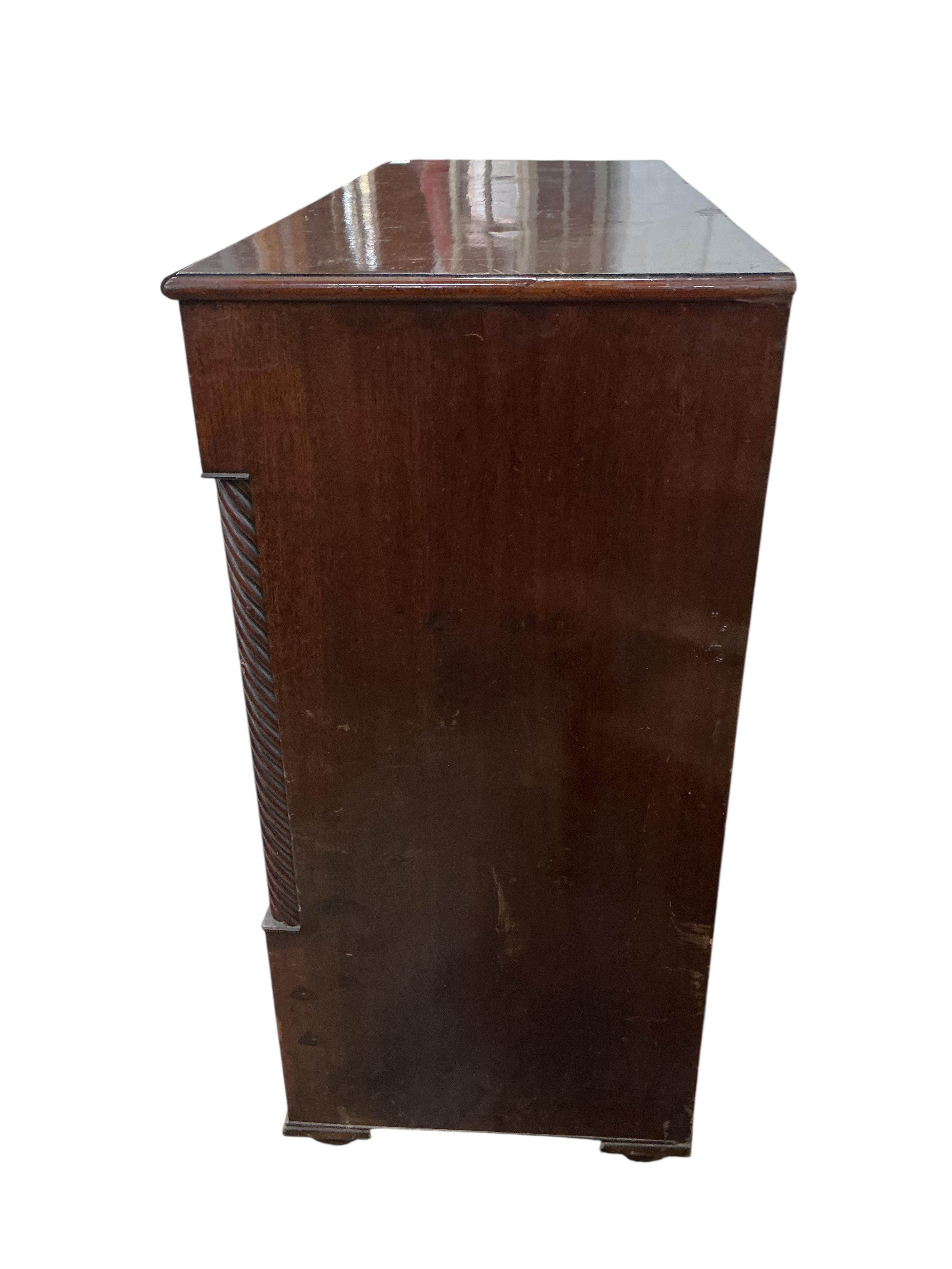 A George IV mahogany chest of drawers, canted corners and bone escutcheons, width 129cm, depth 53cm, height 113cm